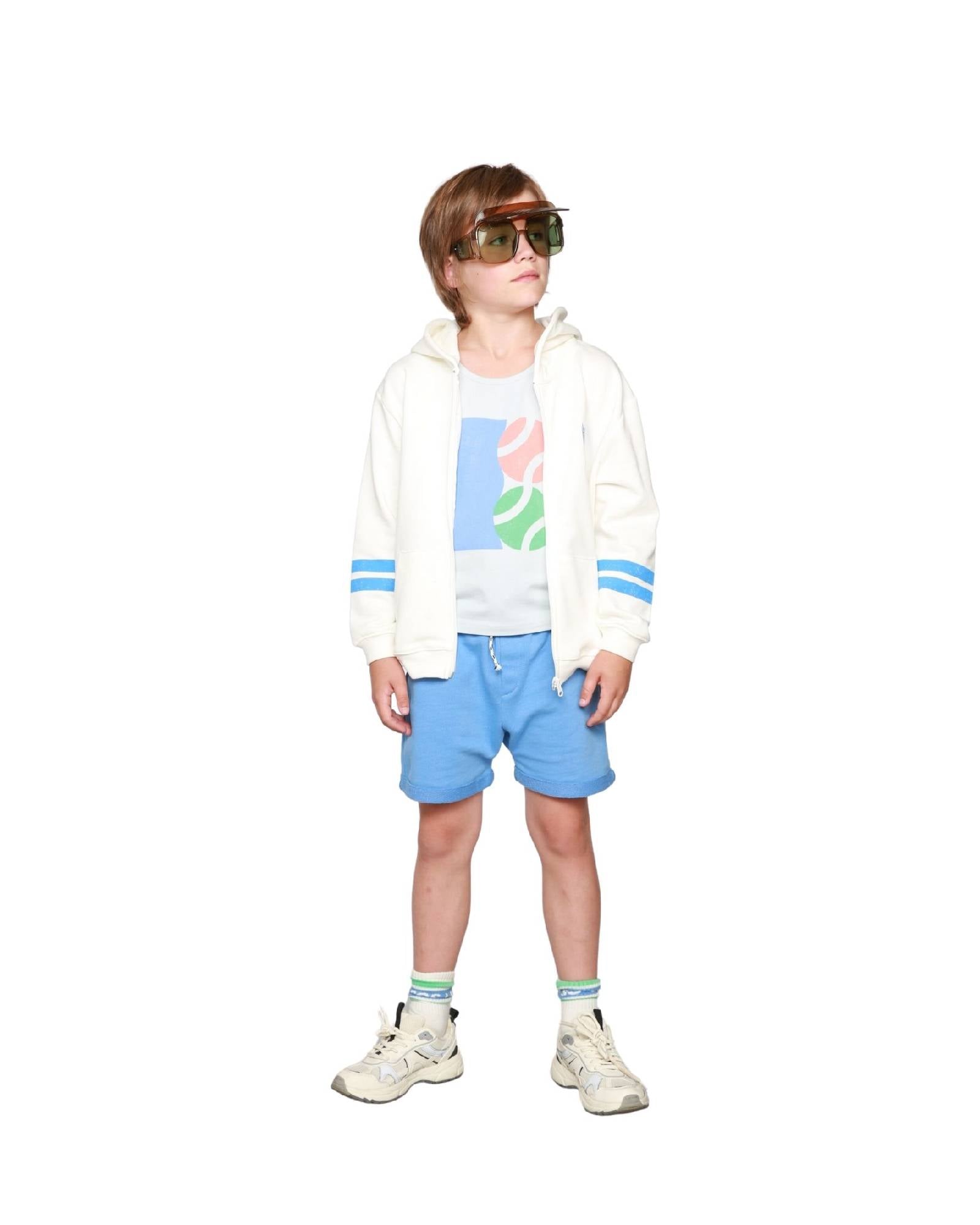 Boy model wearing Tennis Tank Top with the Zip Hoodie Vedette and Jog Shorts in Granada Sky.
