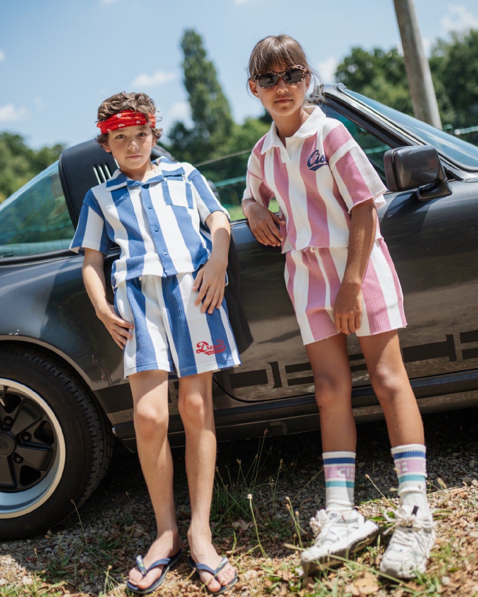 Boy and girl in matching striped outfits