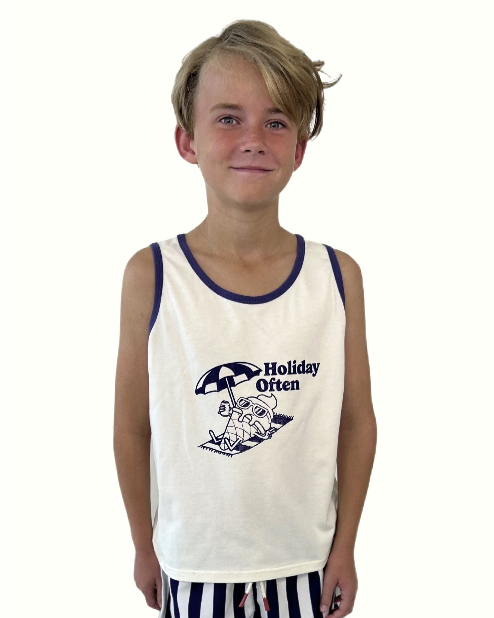 boy model wearing the unisex holiday often tank top in white with the captoin in navy blue