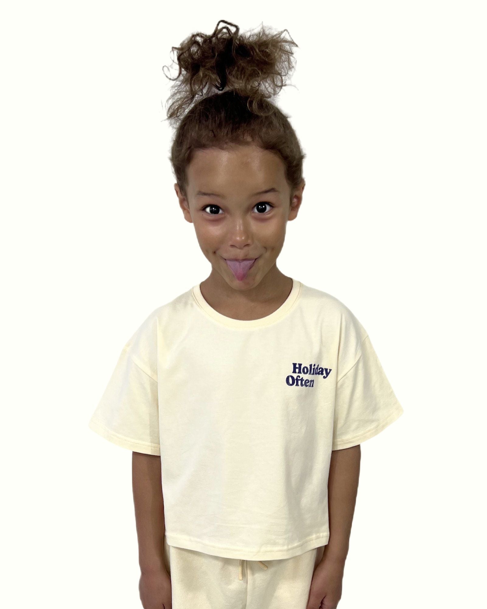 girl model wearing the crop t-shirt holiday often in the color cannoli with the comfy cut off jog shorts in cornhusk by cos i said so