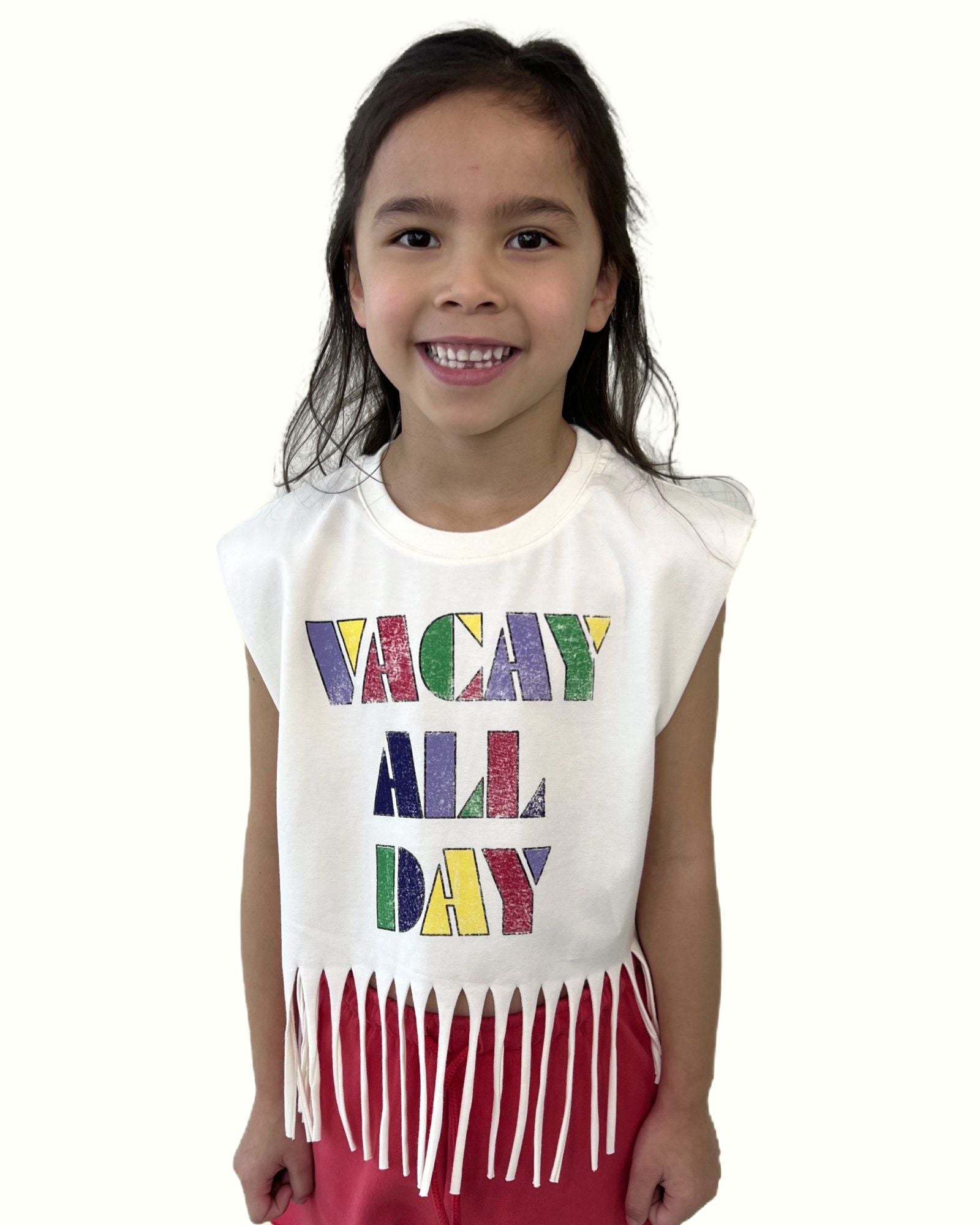 girl model wearing the fringe t-shirt vacay all day by Cos I Said So with the cut off jog shorts in poinsettia red