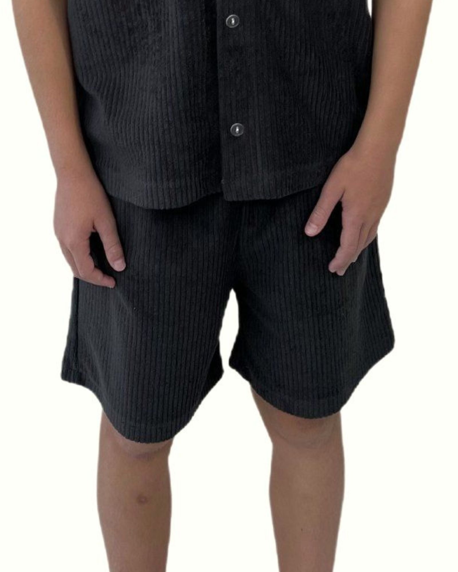 boy model wearing the comfy towel terry shorts in ribbed charcoal by Cos I Said So