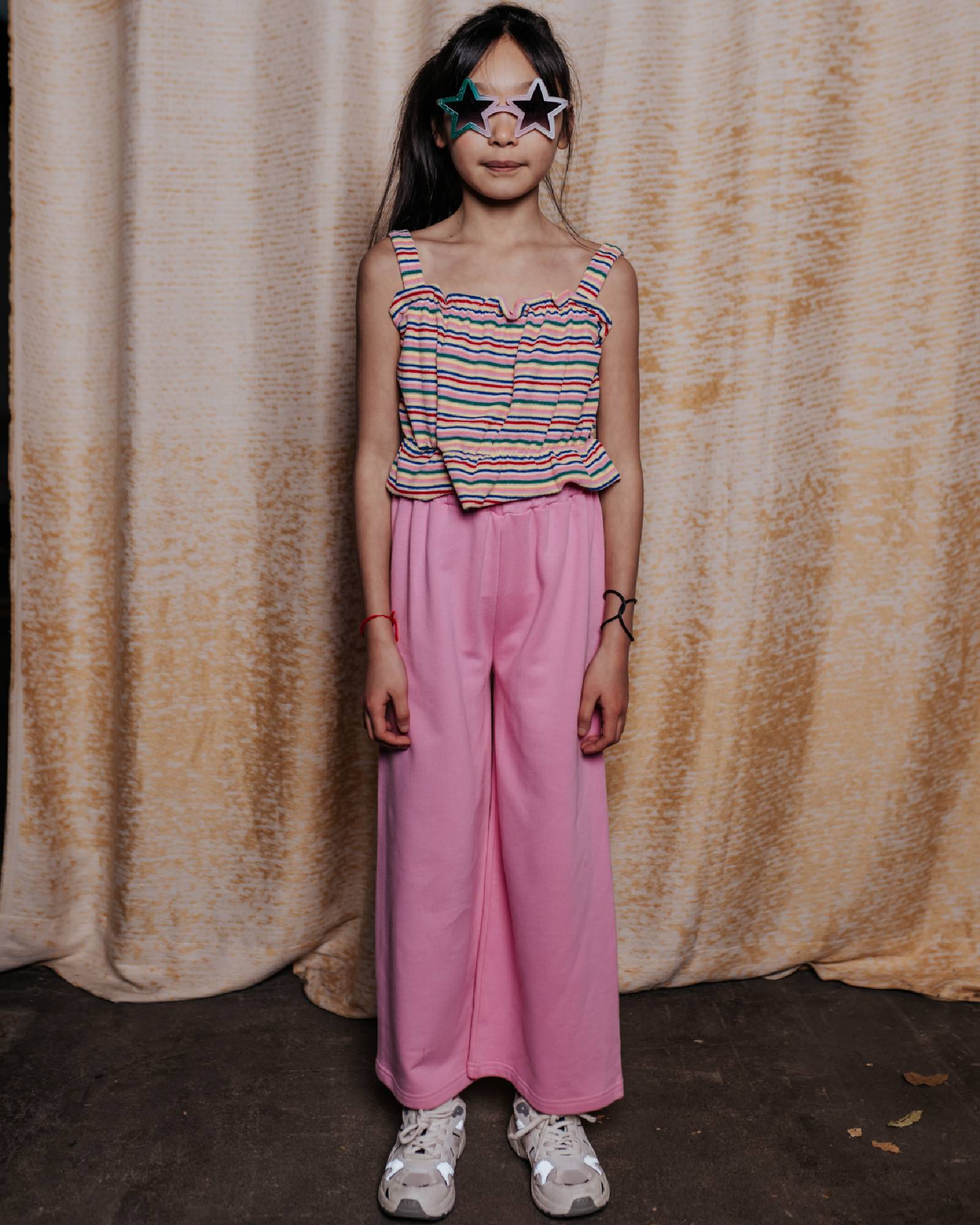 girl model wearing the striped terry crop top in terry cloth