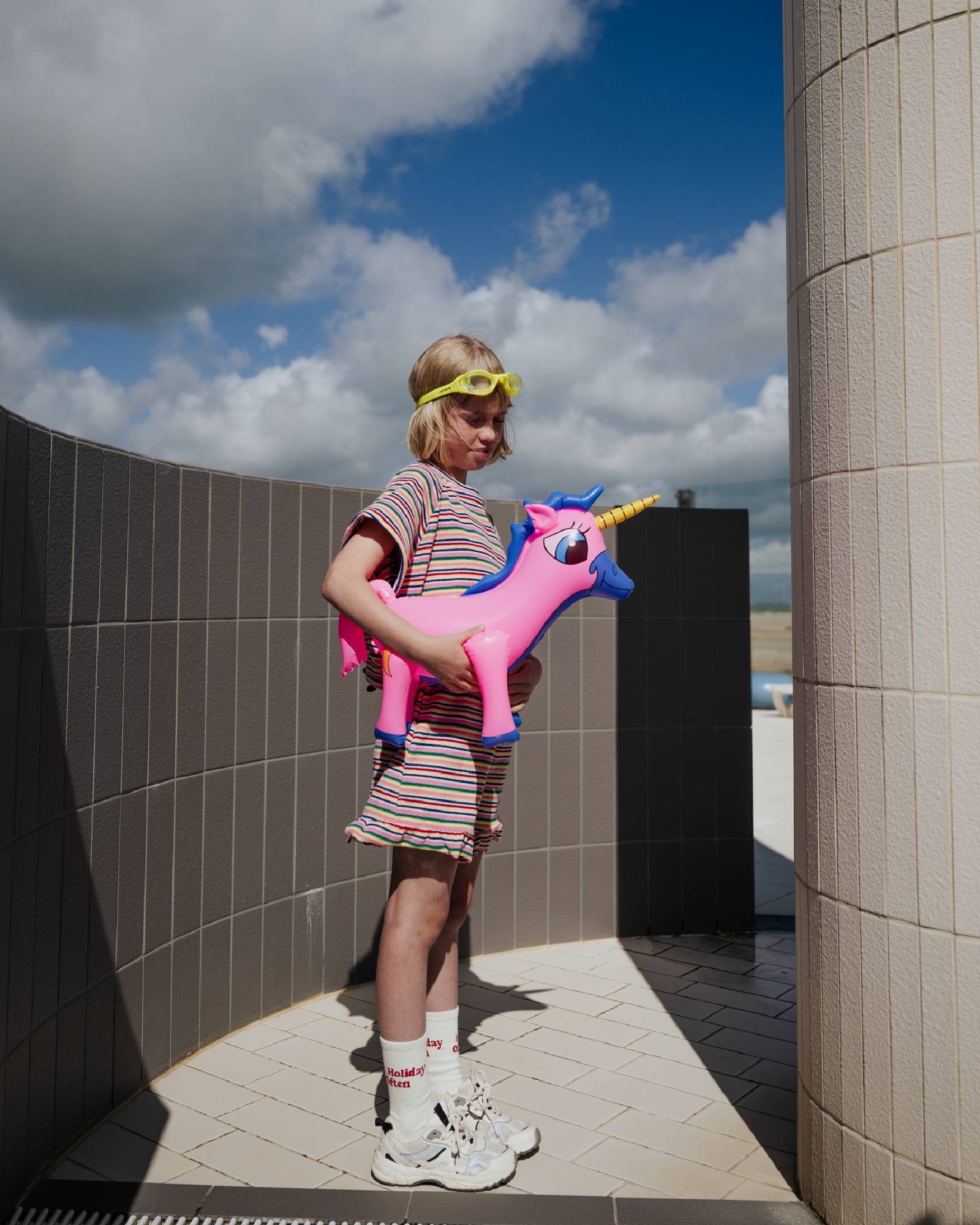 girl model wearing the striped terry ruffle shorts