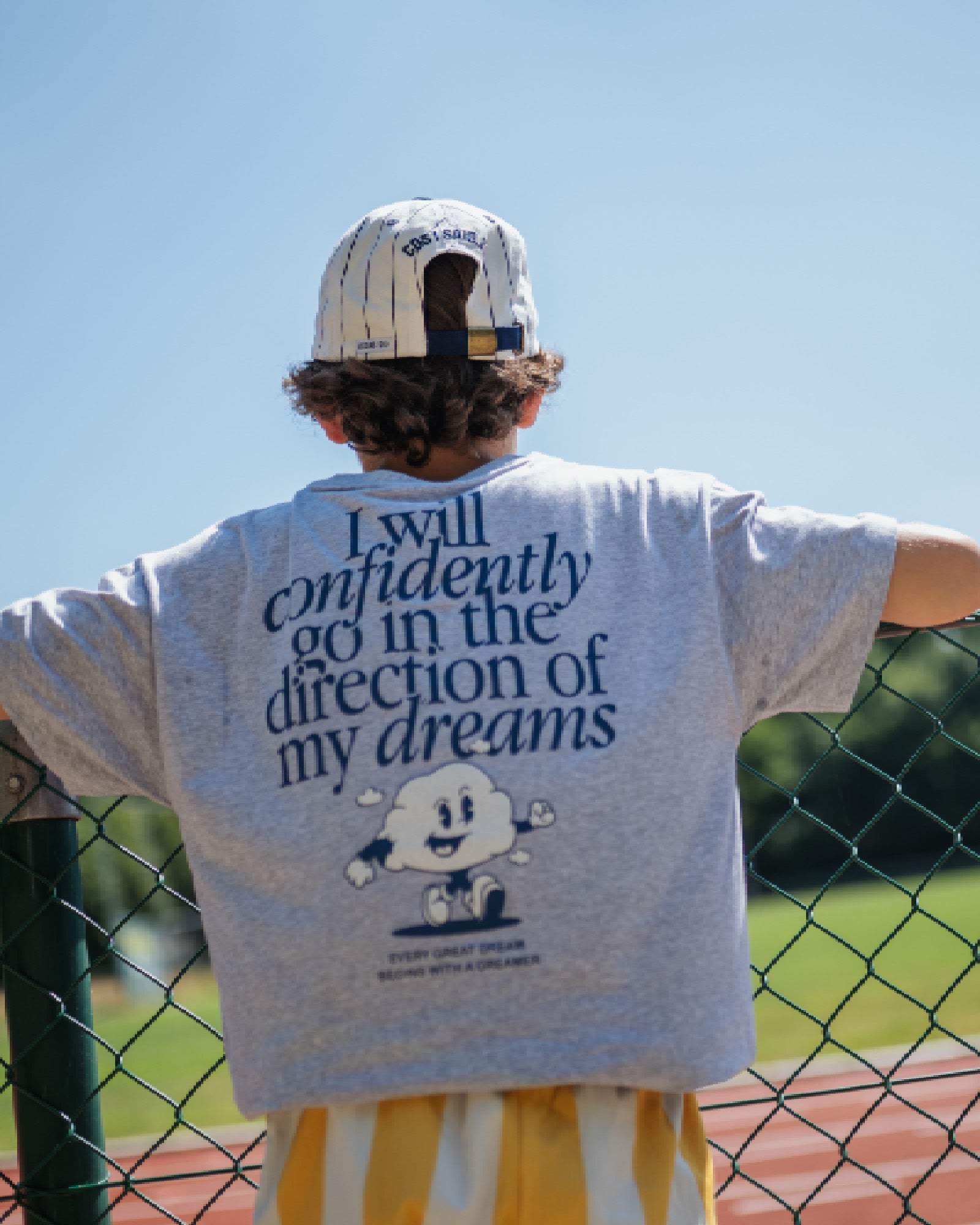 boy model wearing the t-shirt club des rêves in high quality organic cotton in grey by cos I said so