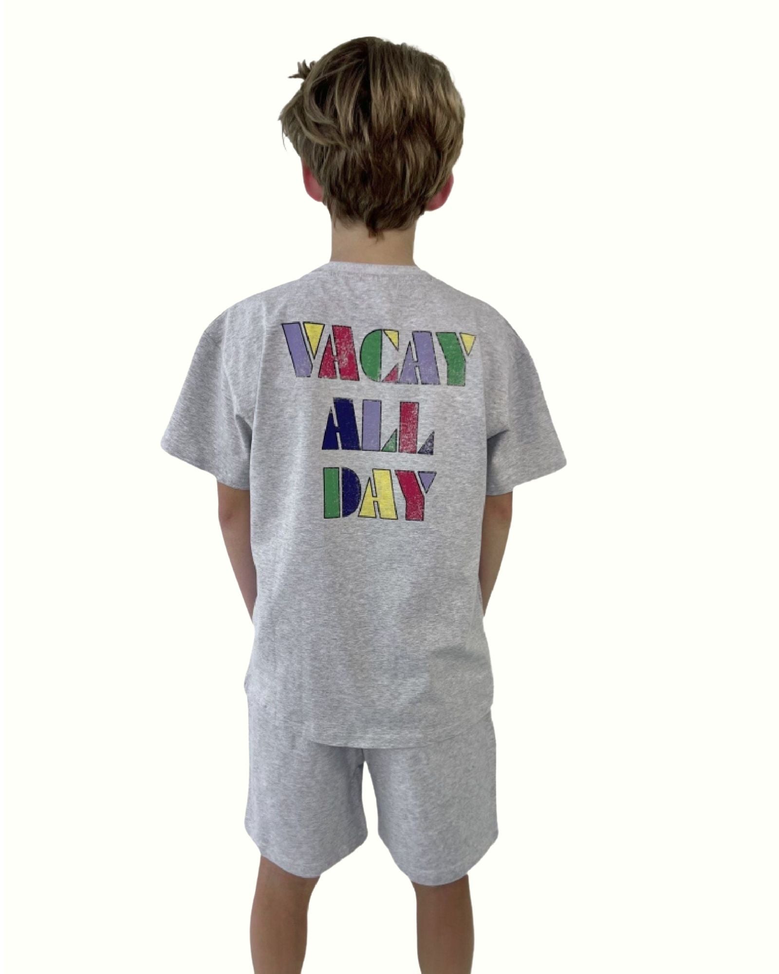 boy model wearing the vacay all day t-shirt in grey in soft organic cotton by Cos I Said So with matching grey jog shorts by Cos I Said So, showing the back
