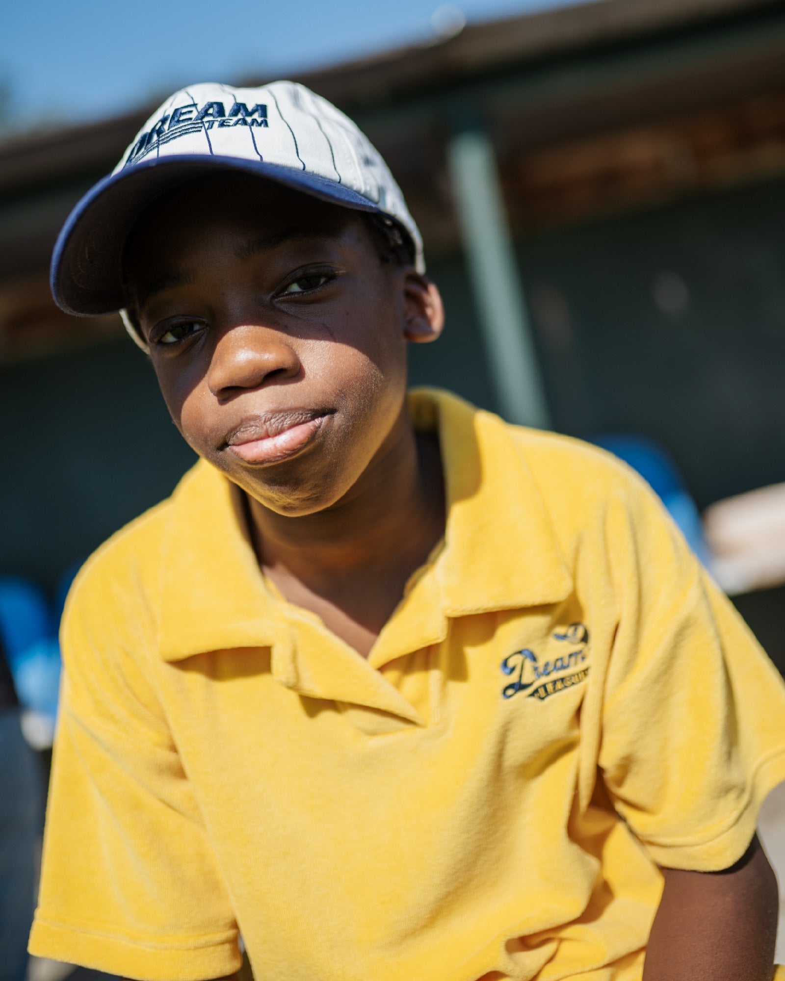 boy model wearing the dream league polo in organic towel terry cotton in mimosa yellow