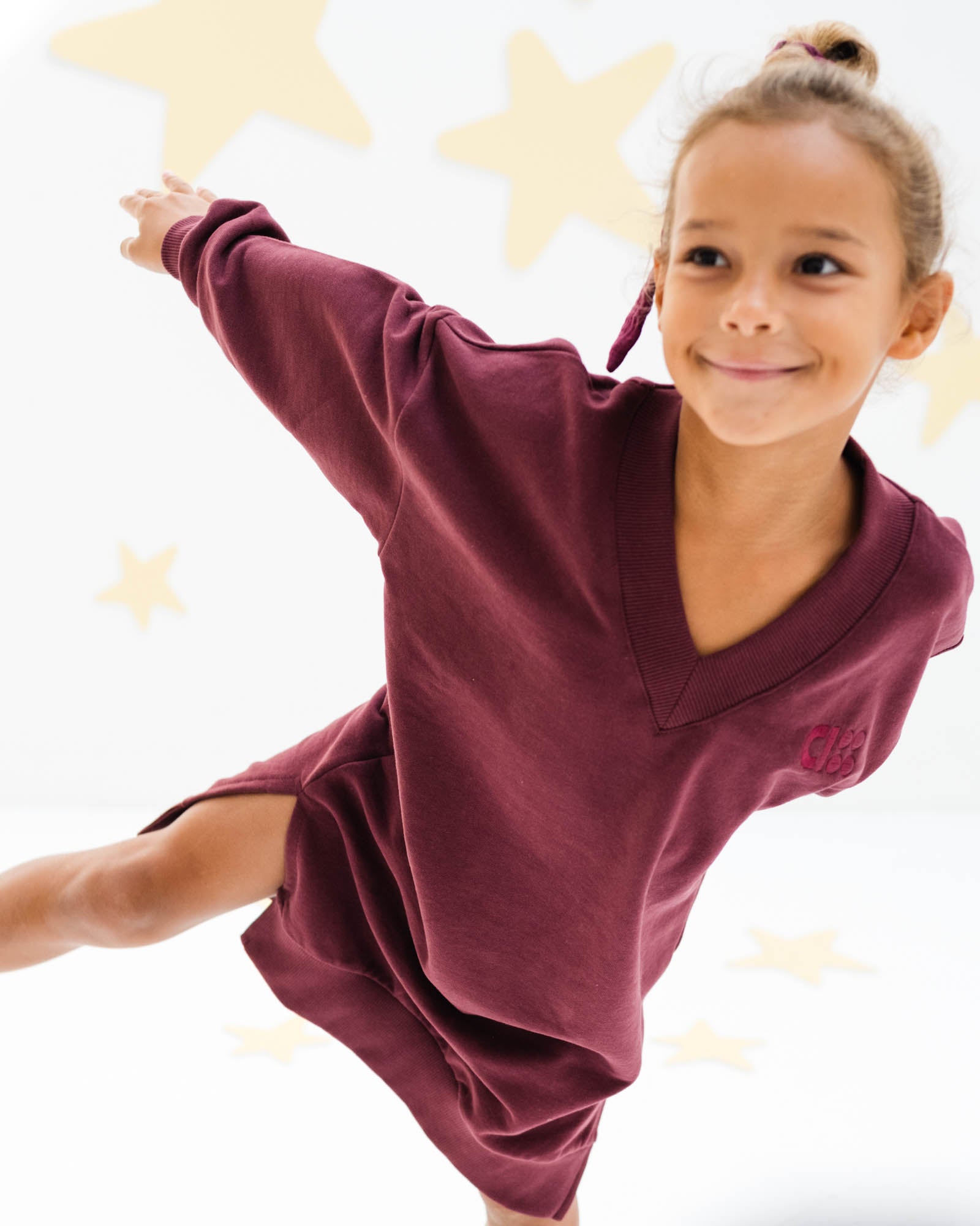 7-year-old girl wearing the comfy V-neck dress in port from Cos I Said So