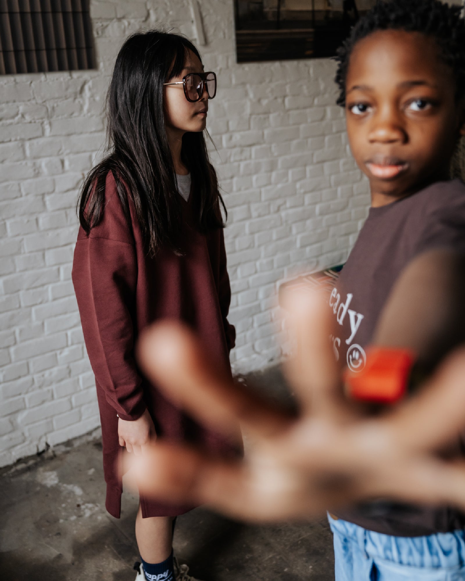 girl model wearing the v-neck sweater dress in port