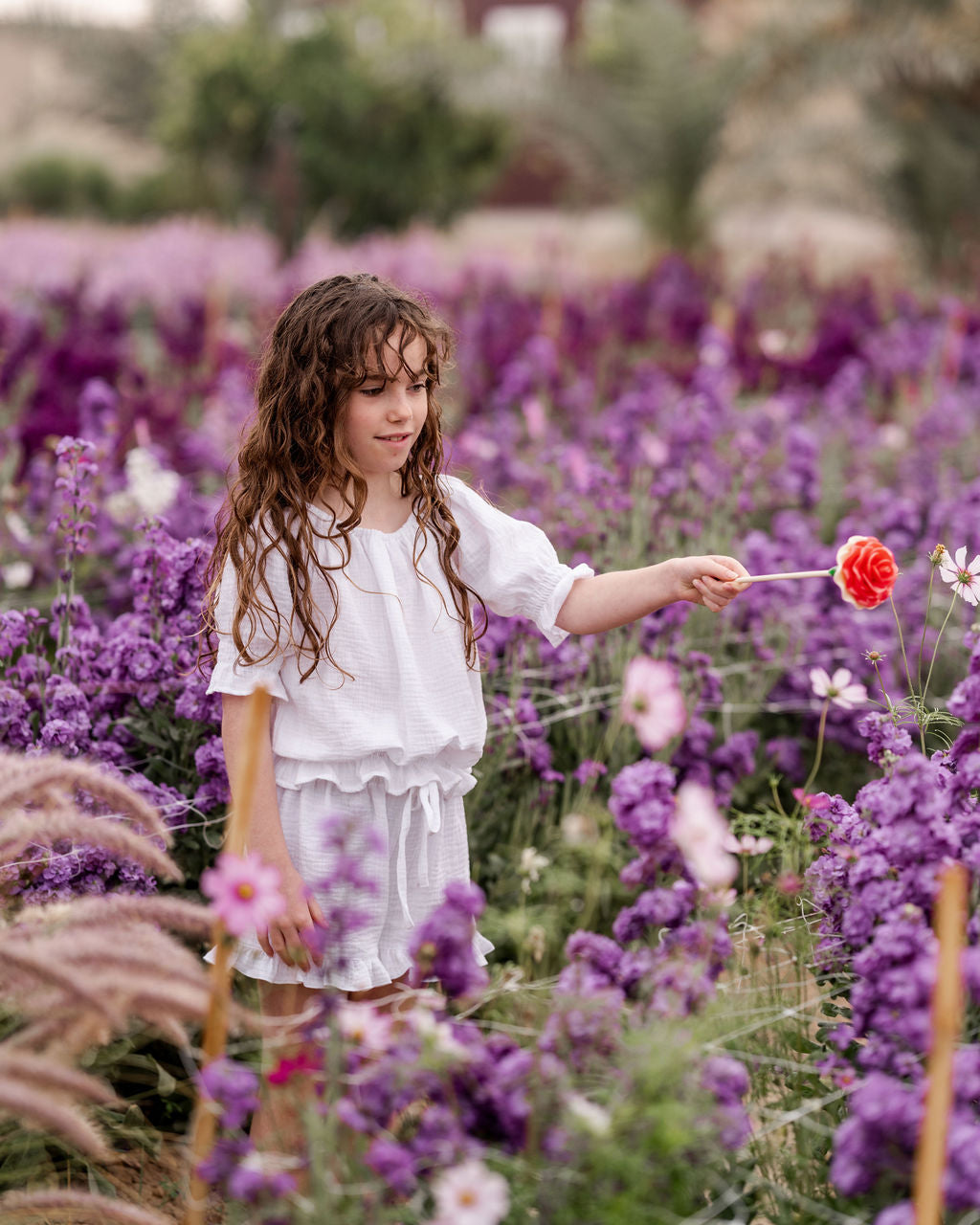 girl model wearing the comfy Charlene shorts in white with matching Alexa top in white muslin cotton