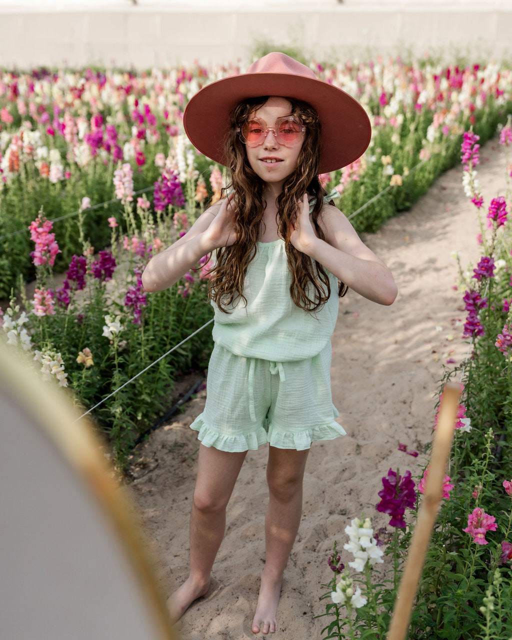 girl model wearing the Miu top in mint muslin cotton with the matching Charlene shorts