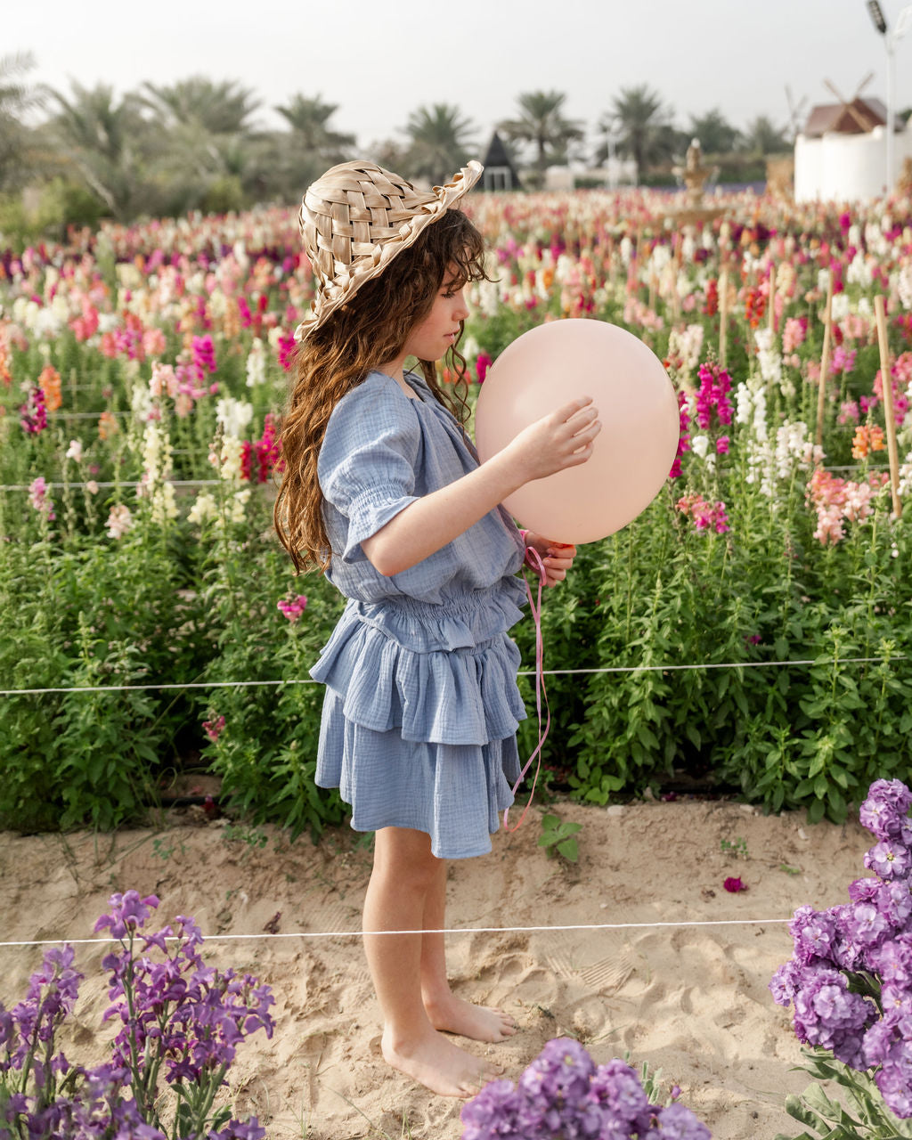 girl model wearing the Lila skirt in cloudy blue muslin cotton