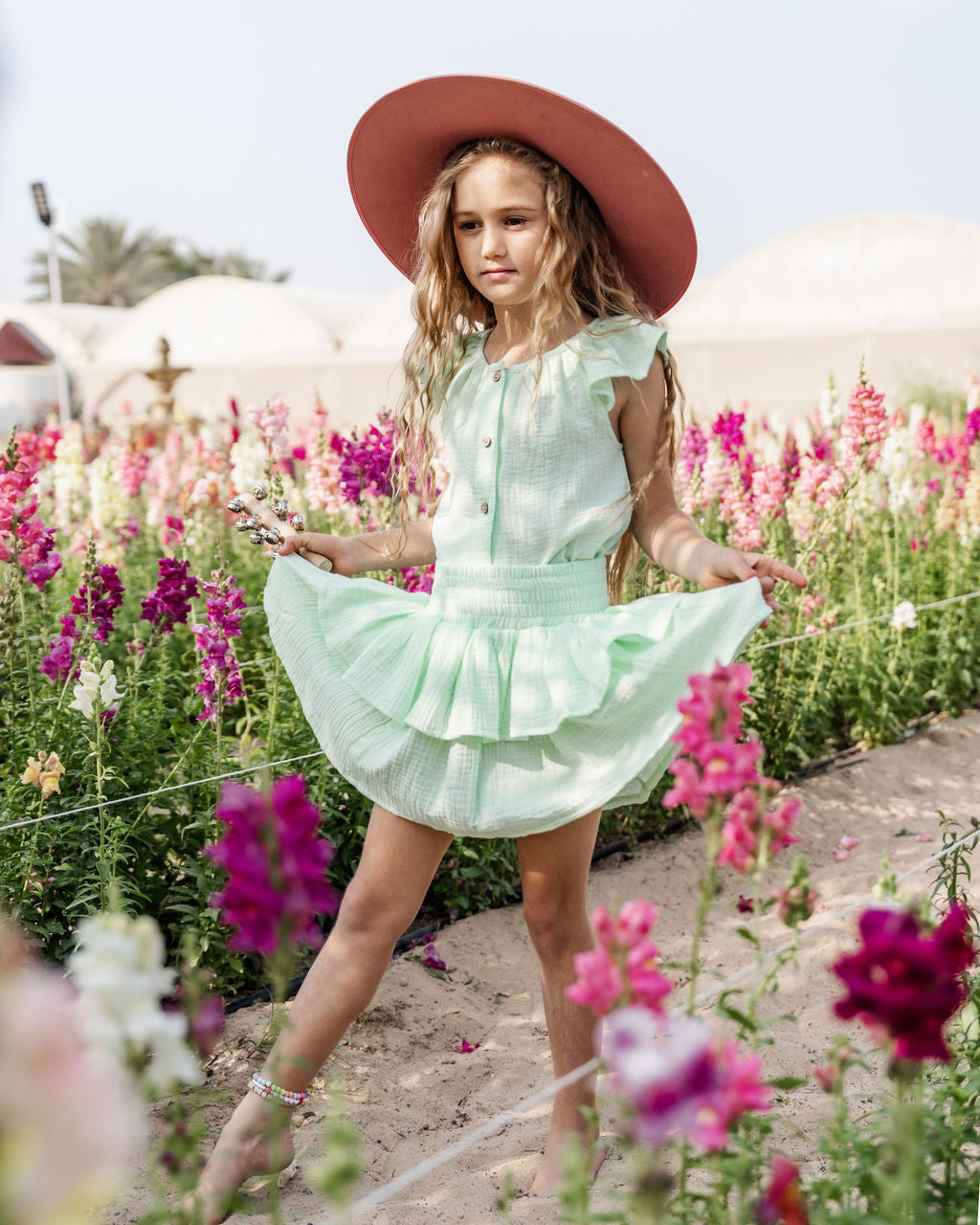 girl model wearing the Lila skirt in mint green with the Lilou top in mint green muslin cotton