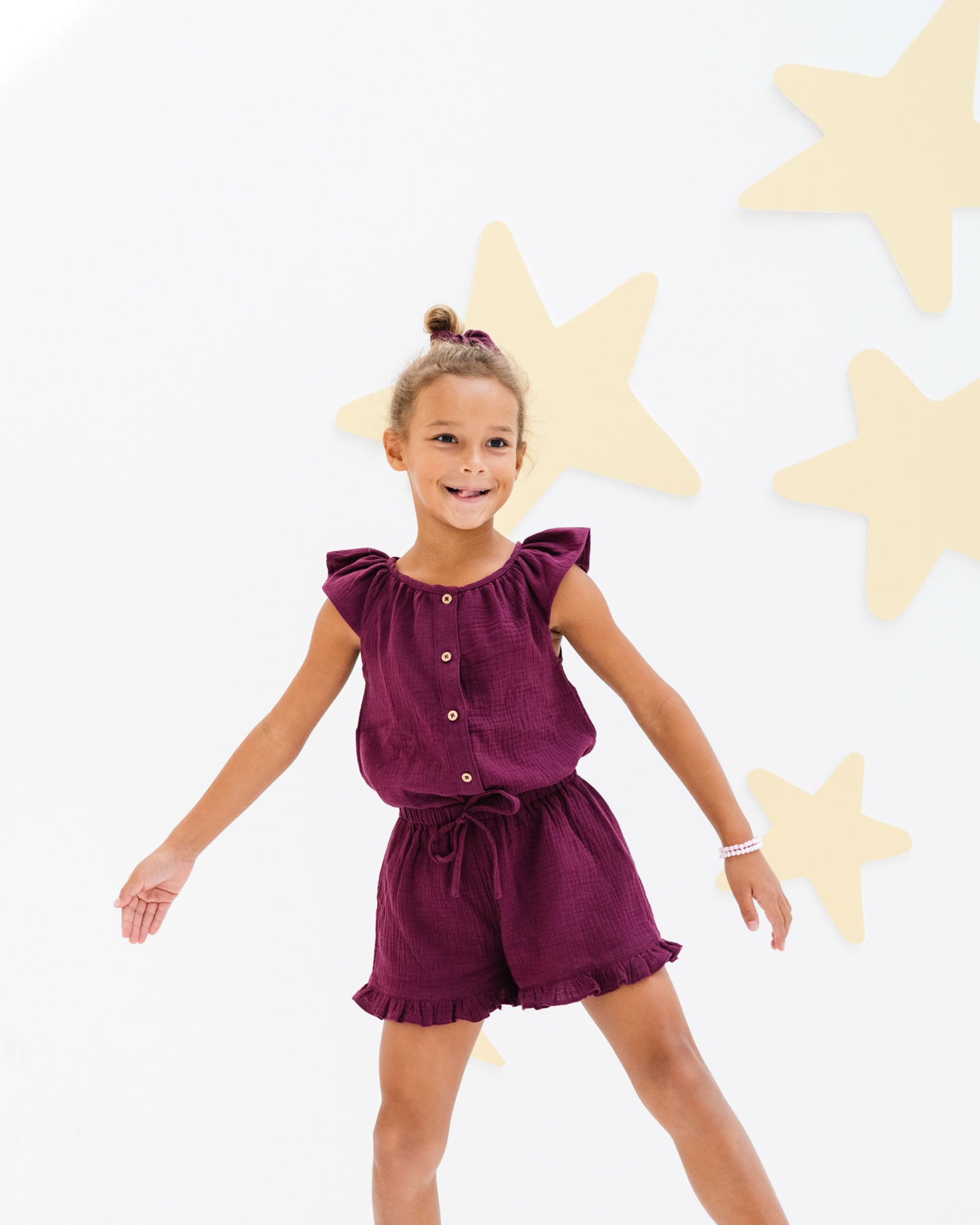 girl model showing the Lilou top in aubergine with matching Charlene shorts in aubergine muslin cotton