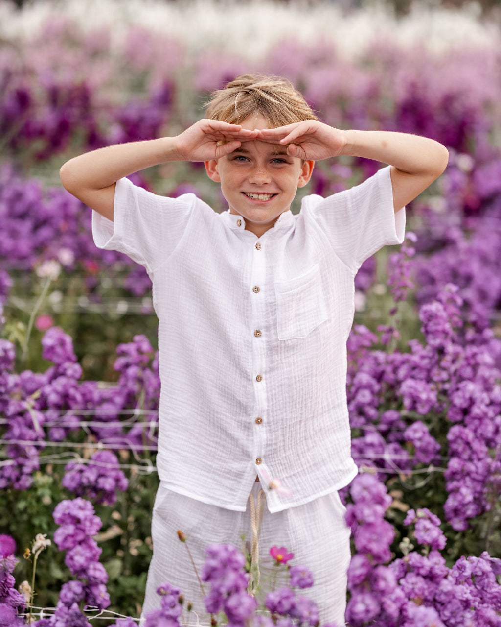10-year-old boy wearing the Raphael shirt with matching Julian shorts in white