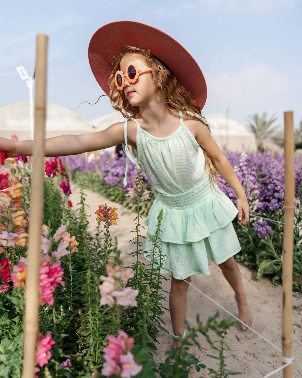 girl model wearing the Miu top and Lila skirt in mint