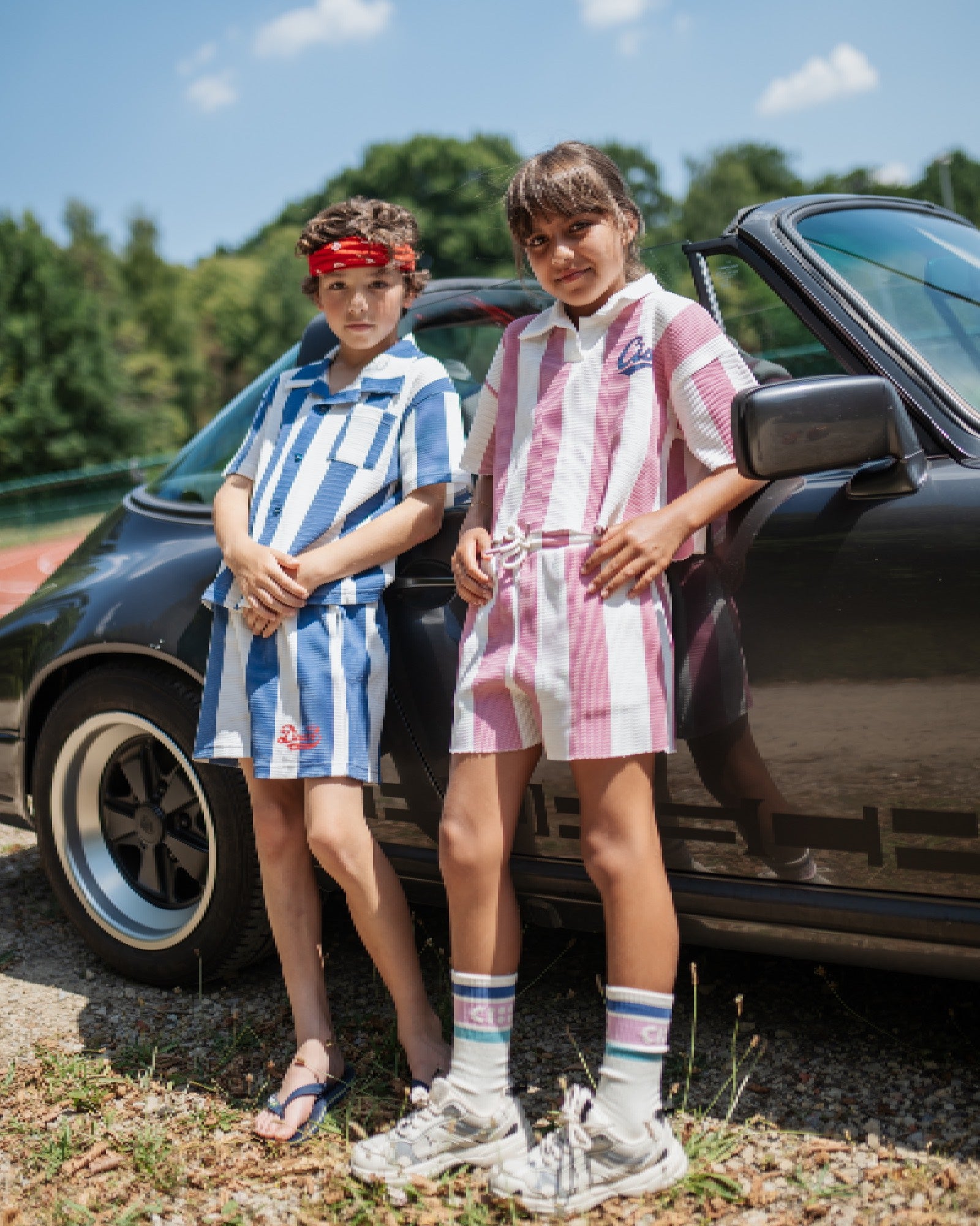 boy and girl wearing matching outfits in different colors in pique bold stripes