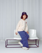 Boy wearing the Hotel Mama Sweater in Crystal Gray in high quality Organic Cotton.