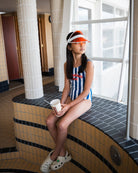girl model wearing the holiday often bathing suit in stripes blue and white