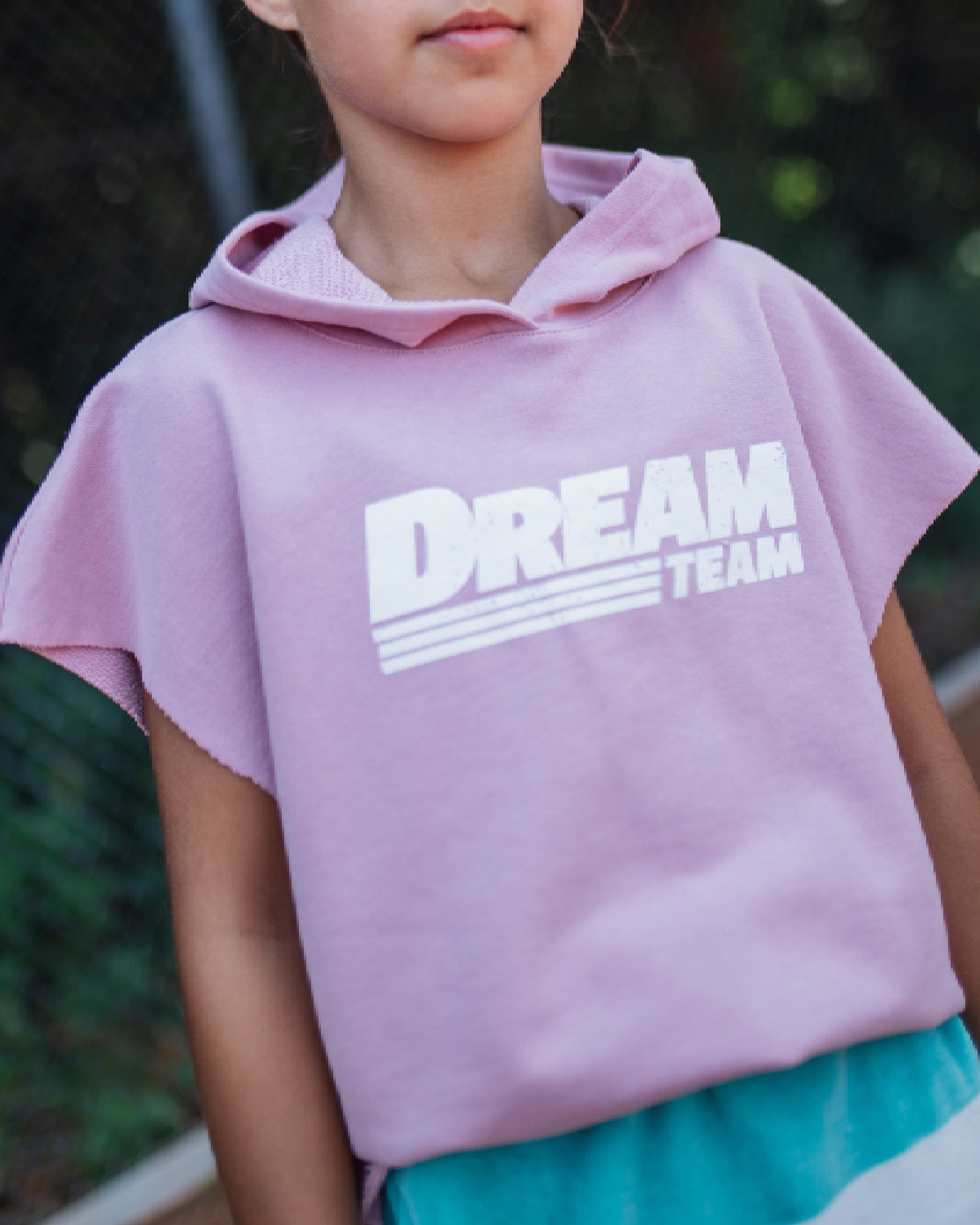 girl model wearing the cut off hoodie dream team