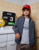 Child wearing the Dogs organic cotton kids T-shirt by Cos I Said So in a campaign image
