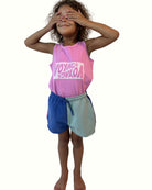 girl model wearing the color block shorts with matching tank top voyage in fuchsia