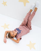 girl model wearing the t-shirt it is already yours with matching jog pants in burlwood