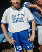 boy model wearing the mesh shorts in blue by cos I said so