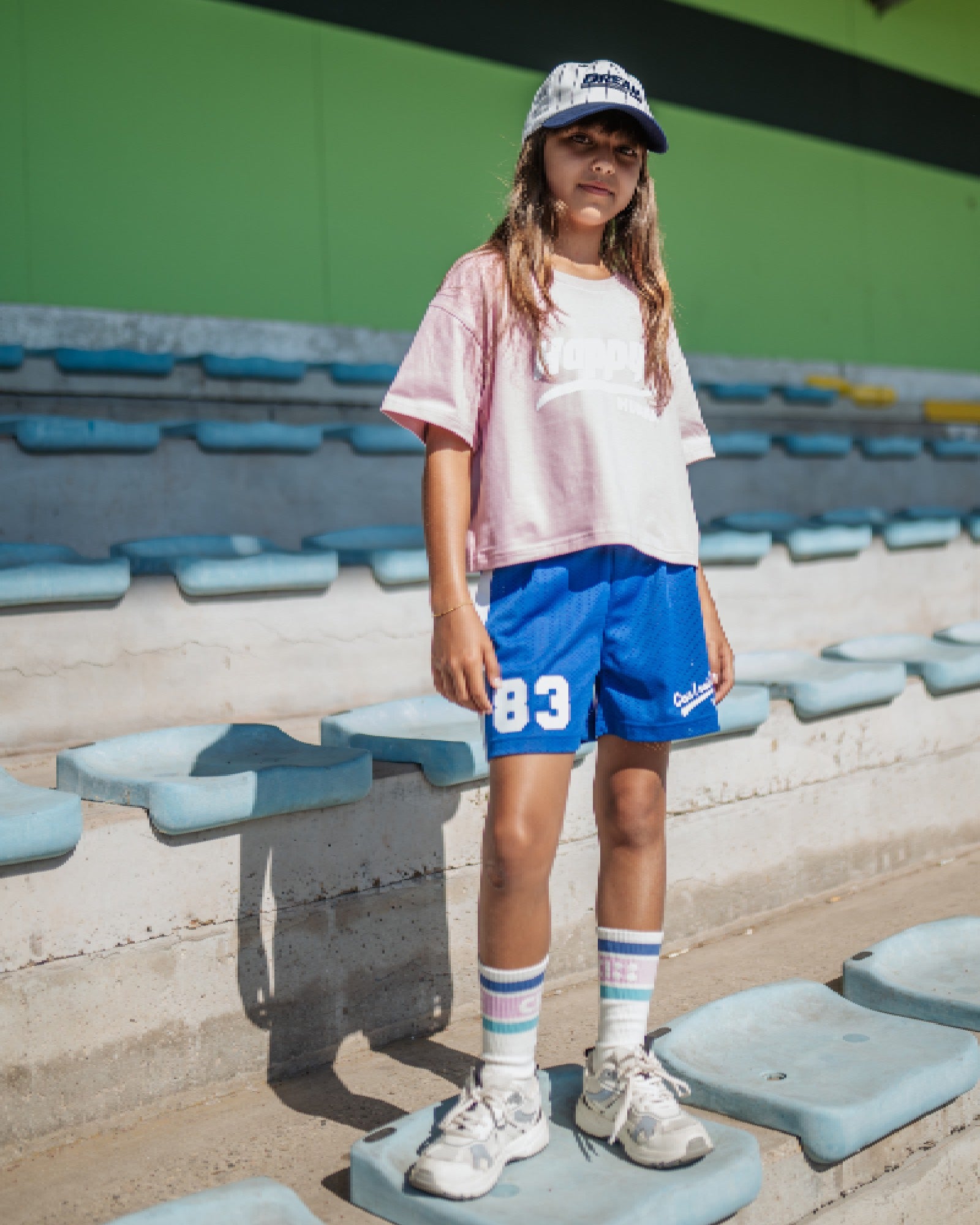 girl model wearing the mesh shorts in blue by cos I said so