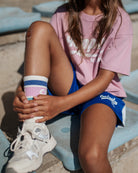 girl model wearing the socks logo by cos I said so