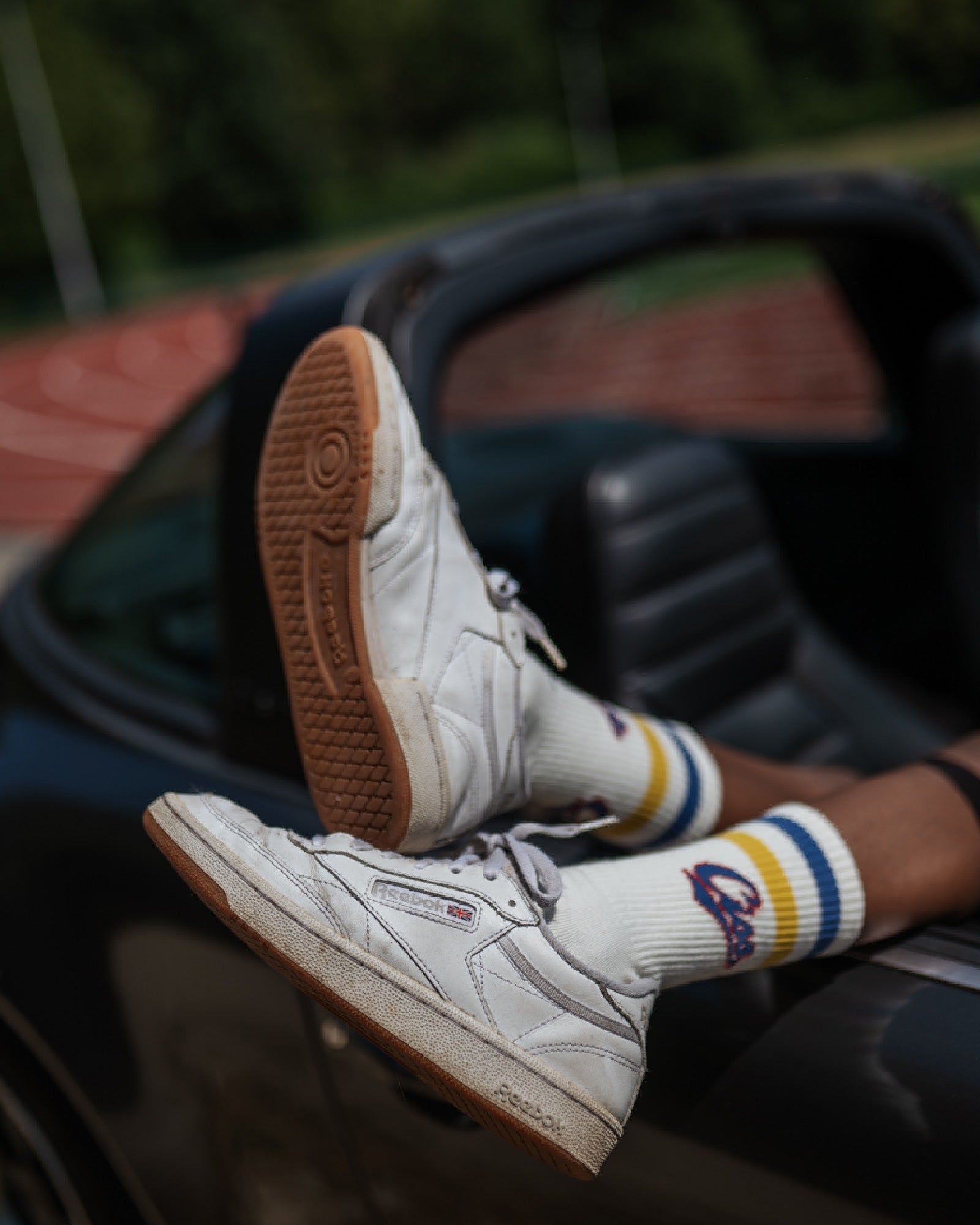 boy model showing the varsity socks by cos I said so, creating a vintage vibe