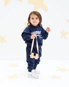 2-year-old boy wearing the happy human sweater and matching jog pants in maritime navy blue from Cos I Said So