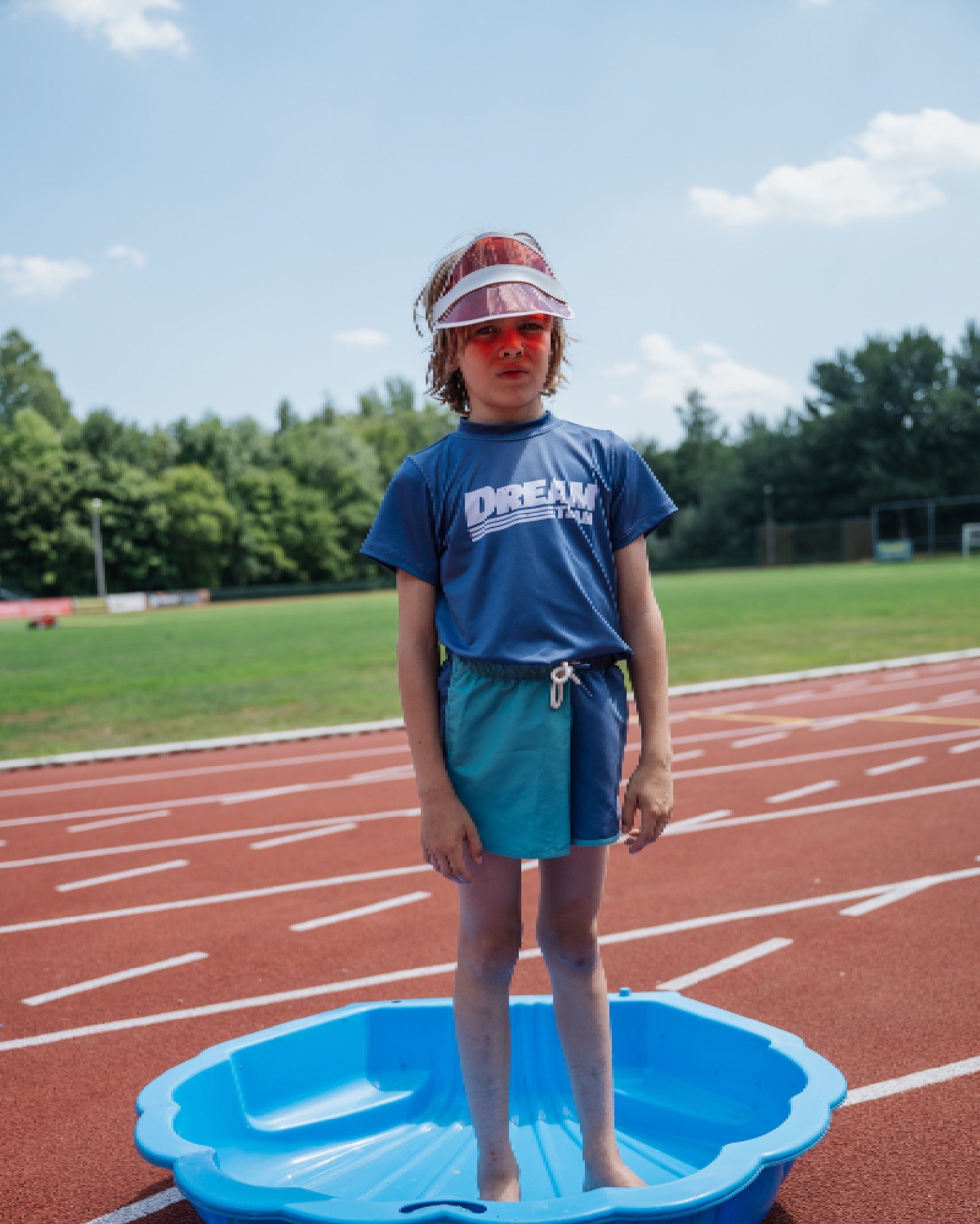 boy model wearing the colour bock swim shorts of cos i said so