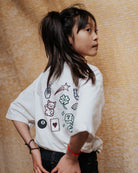 girl model wearing the lucky charms t-shirt in powder from the back 
