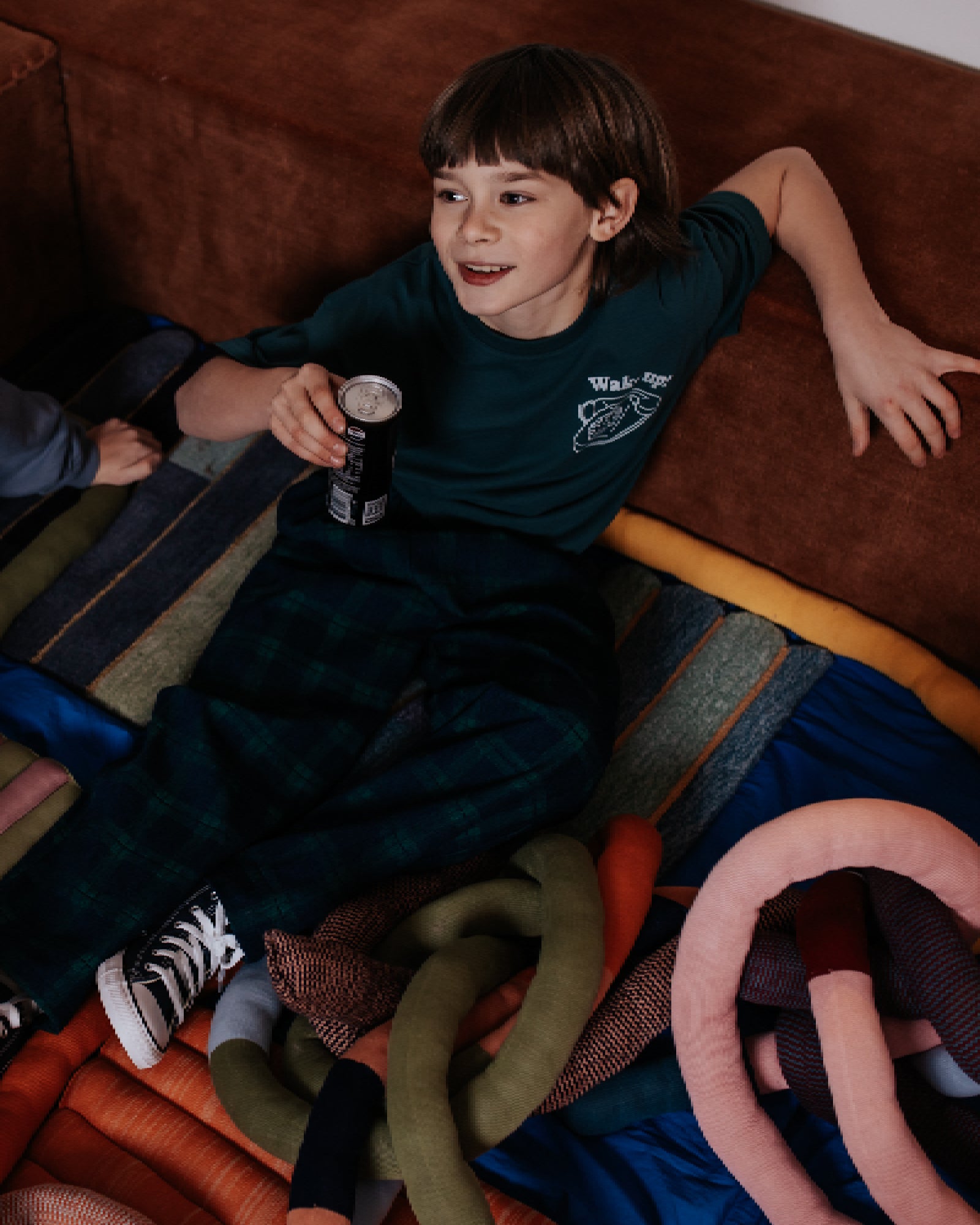 boy model wearing the wake up t-shirt in moss 