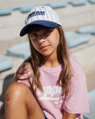 girl model wearing the dream team cap by cos I said so