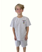boy model wearing the vacay all day t-shirt in grey in soft organic cotton by Cos I Said So with matching grey jog shorts by Cos I Said So