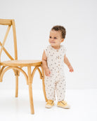 baby boy is showing the lois romper in palm print