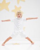 5-year-old boy wearing the Raphael shirt in white with matching Julian shorts