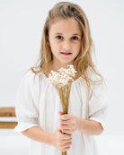 girl model wearing the Alexa dress in white linen muslin